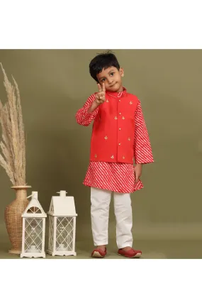 Red leheriya kurta with white churidar and jacket